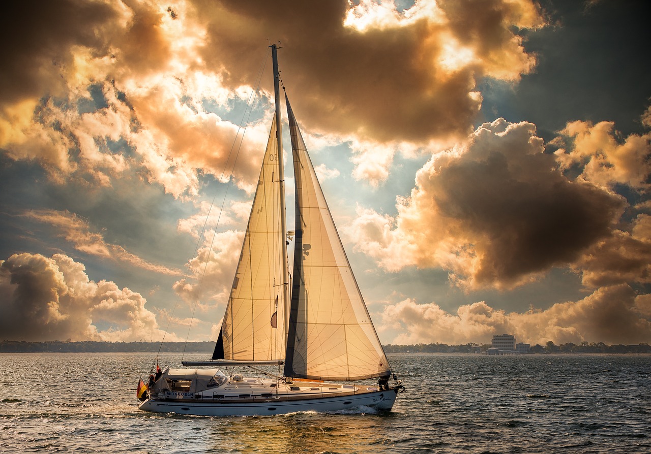 Classic sailing yacht on a Day Sail in calm seas, beautiful sunny weather and majestic white clouds.